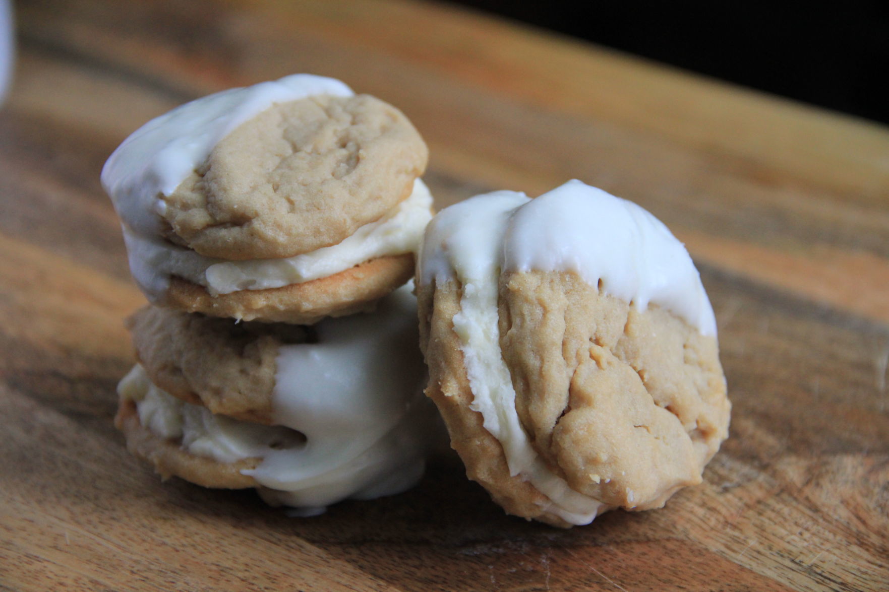 Vanilla Dipped Peanut Butter and Maple Cream Sandwich Cookies